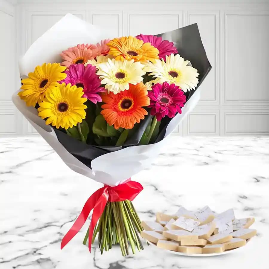 Delicious Kaju Katli and Arrangement of Mixed Gerberas