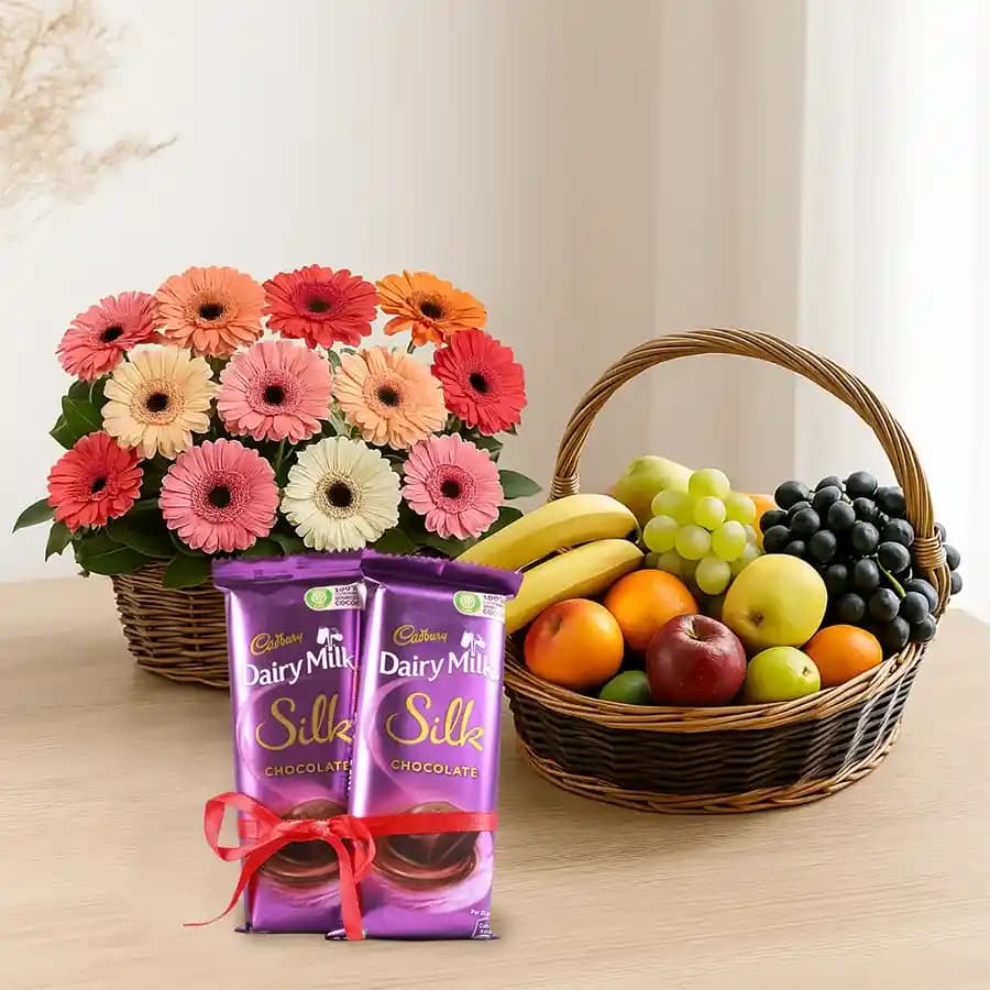 Yummy Mixed Fruits Basket with Gerberas Arrangement and Dairy Milk Silk