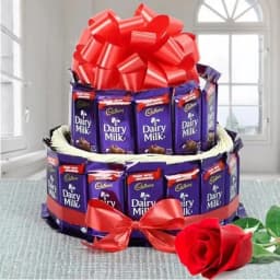 Marvellous 2 Tier Arrangement of Cadbury Dairy Milk Chocolates with Single Red Rose 1