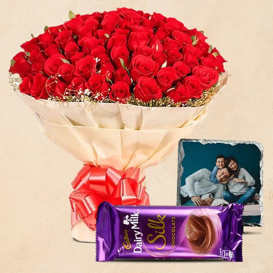 Appealing 50 Red Roses with a Cadbury Silk Chhocolate n Personalized Photo Tile