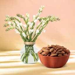Royal Almond Treat from Shree Mithai with Rajnigandha Stems in a Glass Vase 1