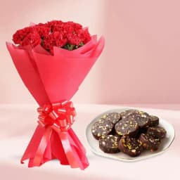 Dry Fruit Dates Roll from Shree Mithai with Red Carnation Tissue Wrapped Bouquet 1