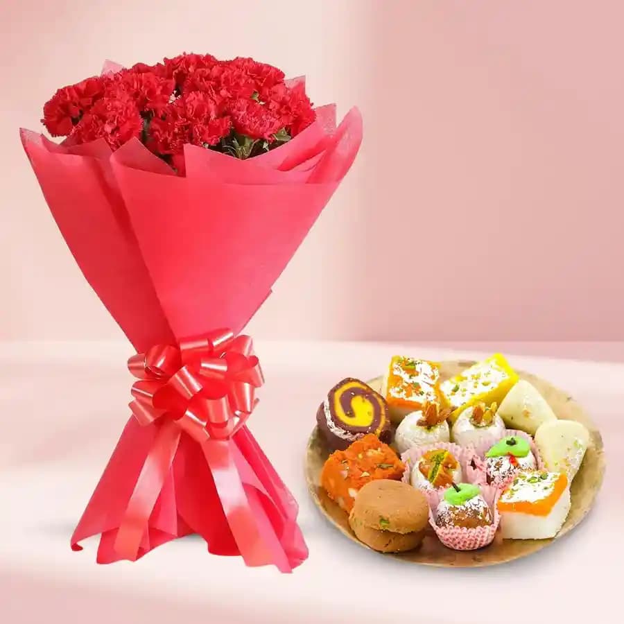 Assorted Sweets from Adyar Ananda Bhawan with Red Carnation Tissue Wrapped Bouquet