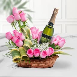 Exotic Arrangement of Pink Roses along with a Bottle of Sparkling Fruit Juice 1