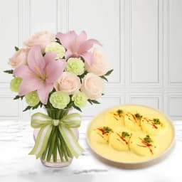 Sweet Harmony: Rasmalai Treat with Elegant Floral Arrangement 1