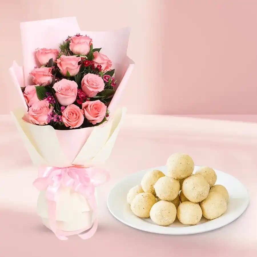 Lavish Treat of Raja Laddu from Ananda Bhawan with Pink Roses Bunch