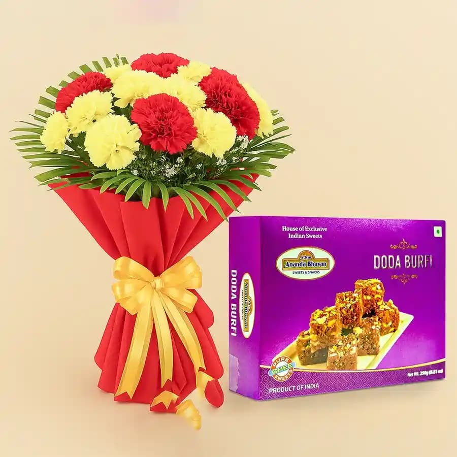 Classic Dodha Burfi from Ananda Bhawan with Red N Yellow Carnations Bunch