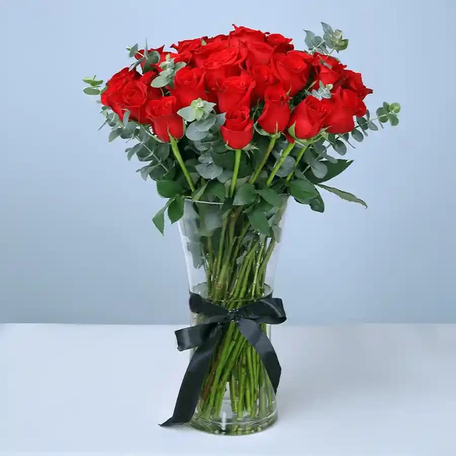 Blushing Red Roses in Glass Vase
