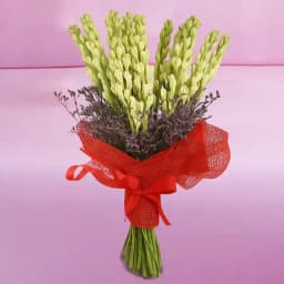 Elegant Hand Designed Bouquet of Rajnigandha in Tissue Wrapping 1