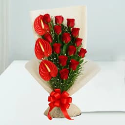Amusing Red Roses N Anthurium Bouquet Wrapped in Tissue 1