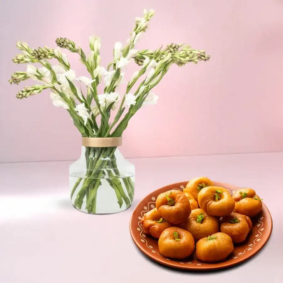 Balushahi from Karachi Sweet Mart with Rajnigandha Stems in Glass Vase