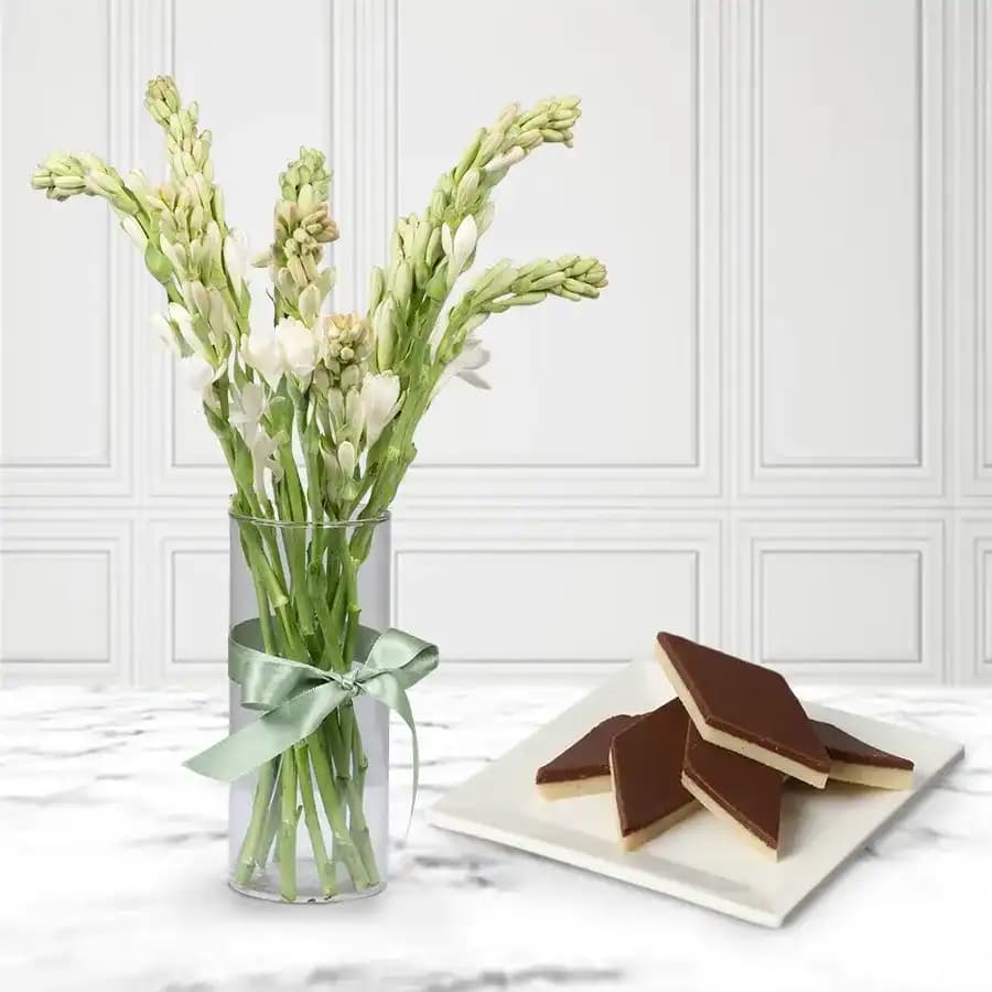 Chocolate Katli from Mithas Delicious Sweets with Rajanigandha Stems in Glass Vase