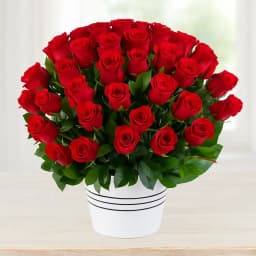 100 Exclusive Red Dutch Red Roses Arrangement with Assorted Cadburys Chocolate. 1