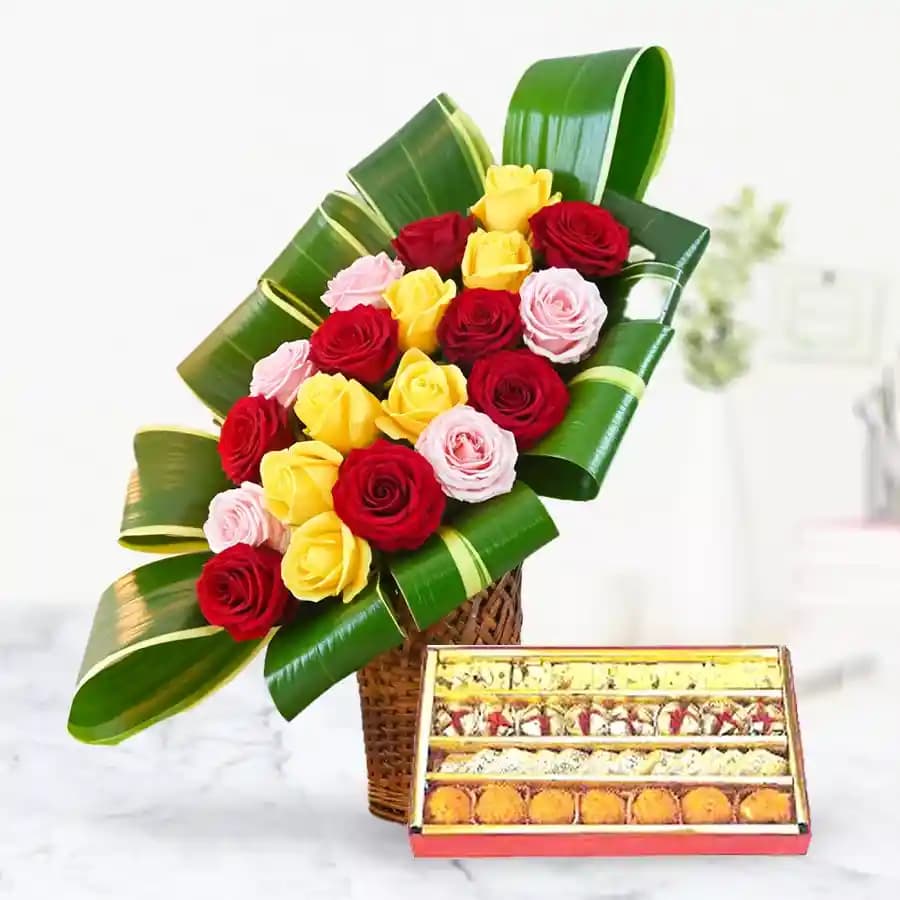 Admirable colorful mixed Roses and palatable assorted Sweets