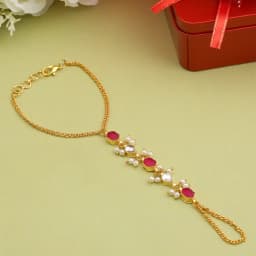 Elegantly Crafted Gold Hand Chain with Soft Pink Details 1