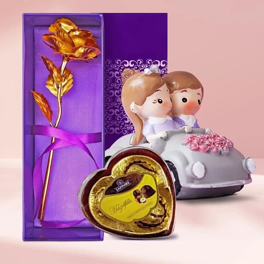 Admirable Loving Couple showpiece with Sapphire Heart Chocolate Box n Golden Rose