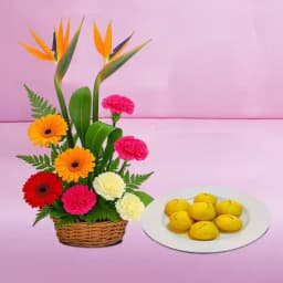 Stunning Floral Arrangement with Traditional Sweet Treats 1
