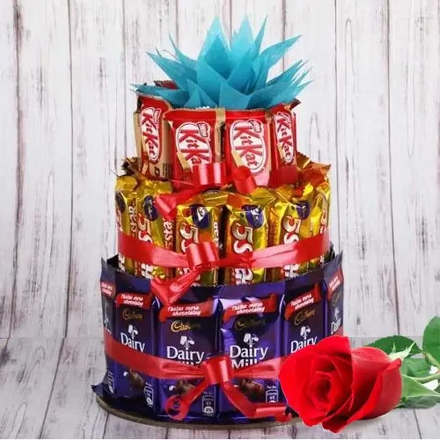 Marvellous 3 tier Arrangement of Assorted Chocolates with Single Red Rose