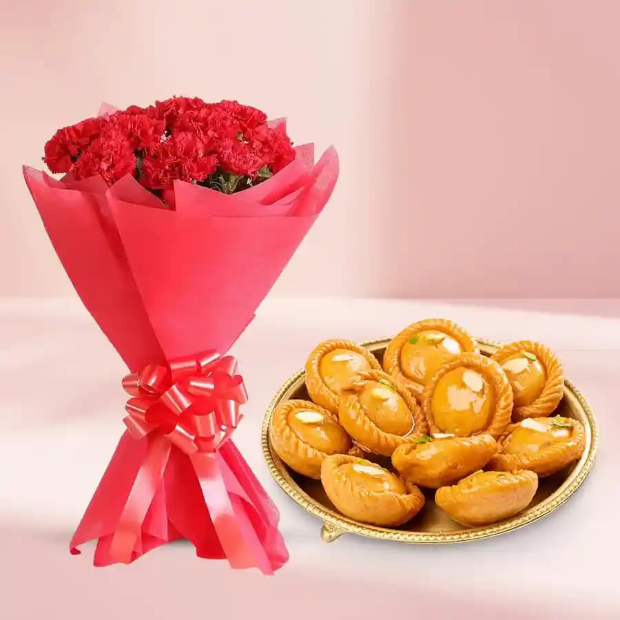 Suryakala from Dadus with Red Carnation Tissue Wrapped Bouquet